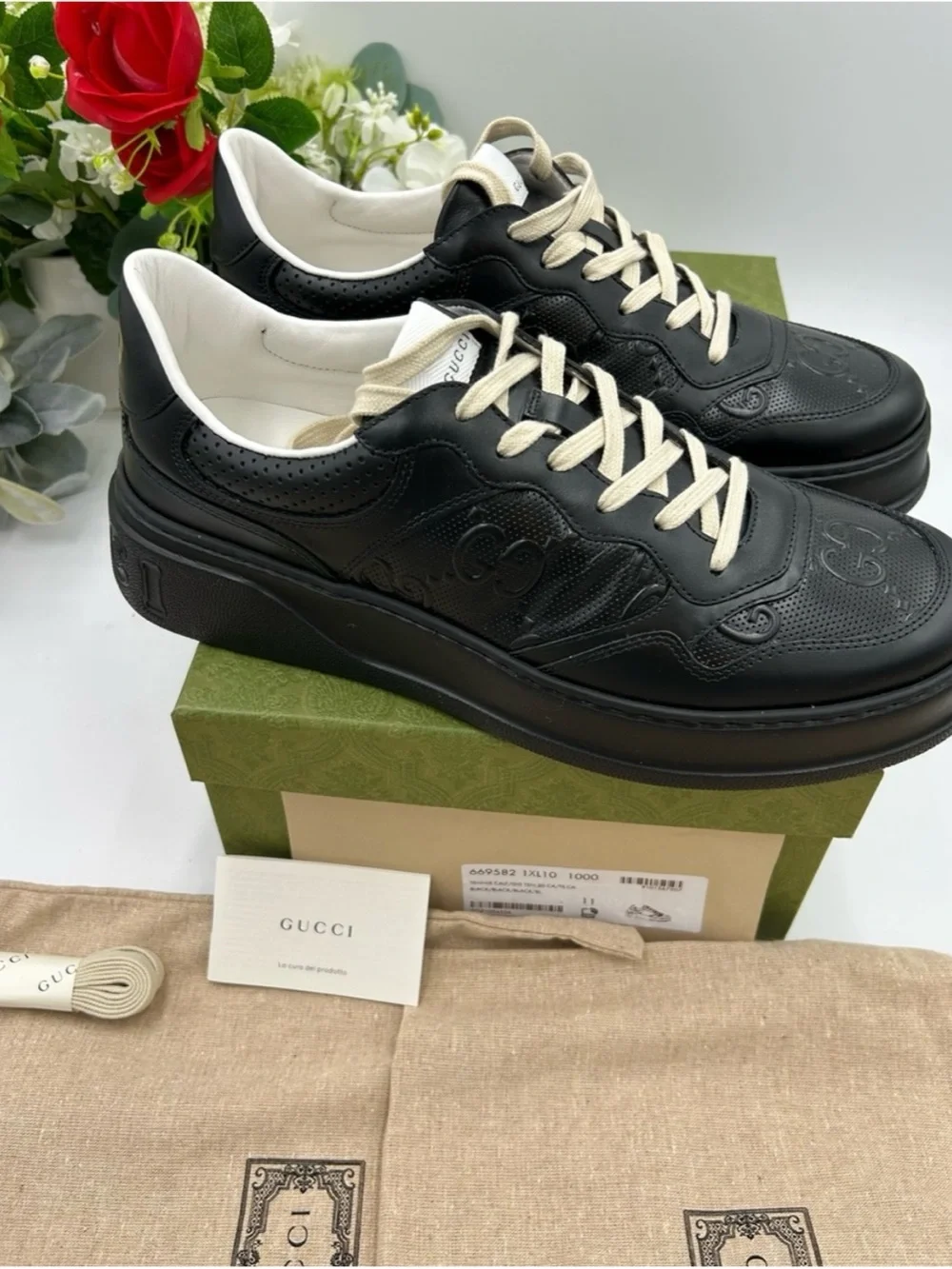 Gucci, GG embossed, black leather sneakers size 9.5 fits 10 made in Italy